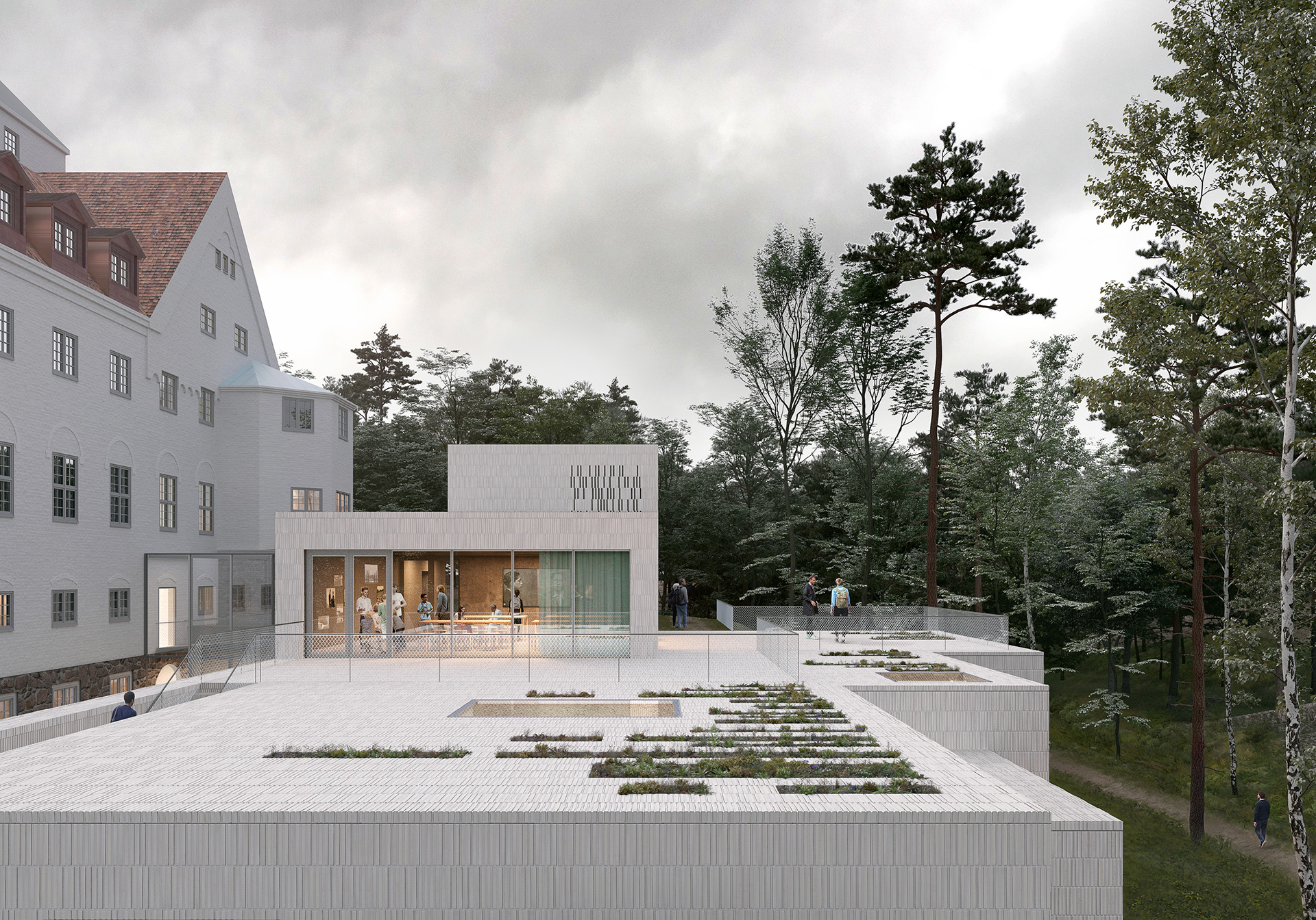 Hvit bygning med stor terrasse